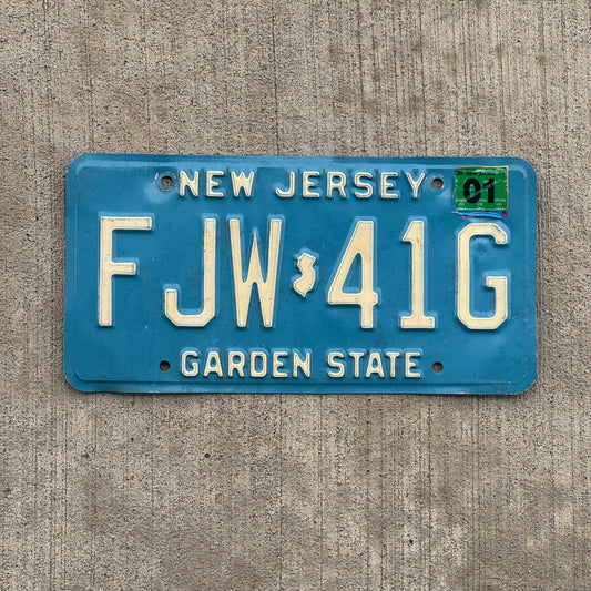 Photo of a 1979 2001 New Jersey License Plate Auto Tag 2 Vintage Garage Blue FJW 41G with original patina