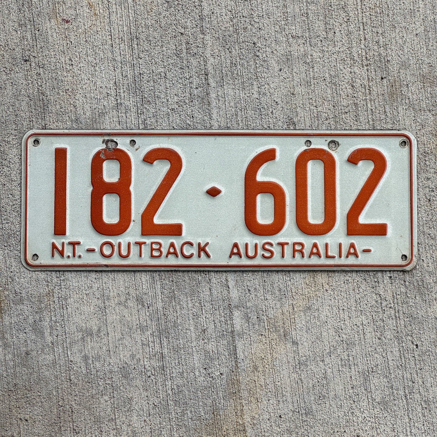 Photo of a 1979 Australia License Plate Auto Tag Garage Decor Vintage Northern Territory Outback 182 602 with original patina