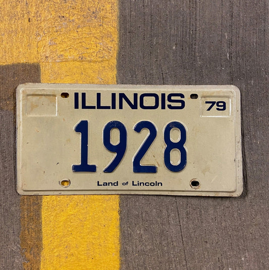 Photo of a 1979 Illinois License Plate Auto Tag Garage Decor Vintage Low Number Four Digit 1928 with original patina