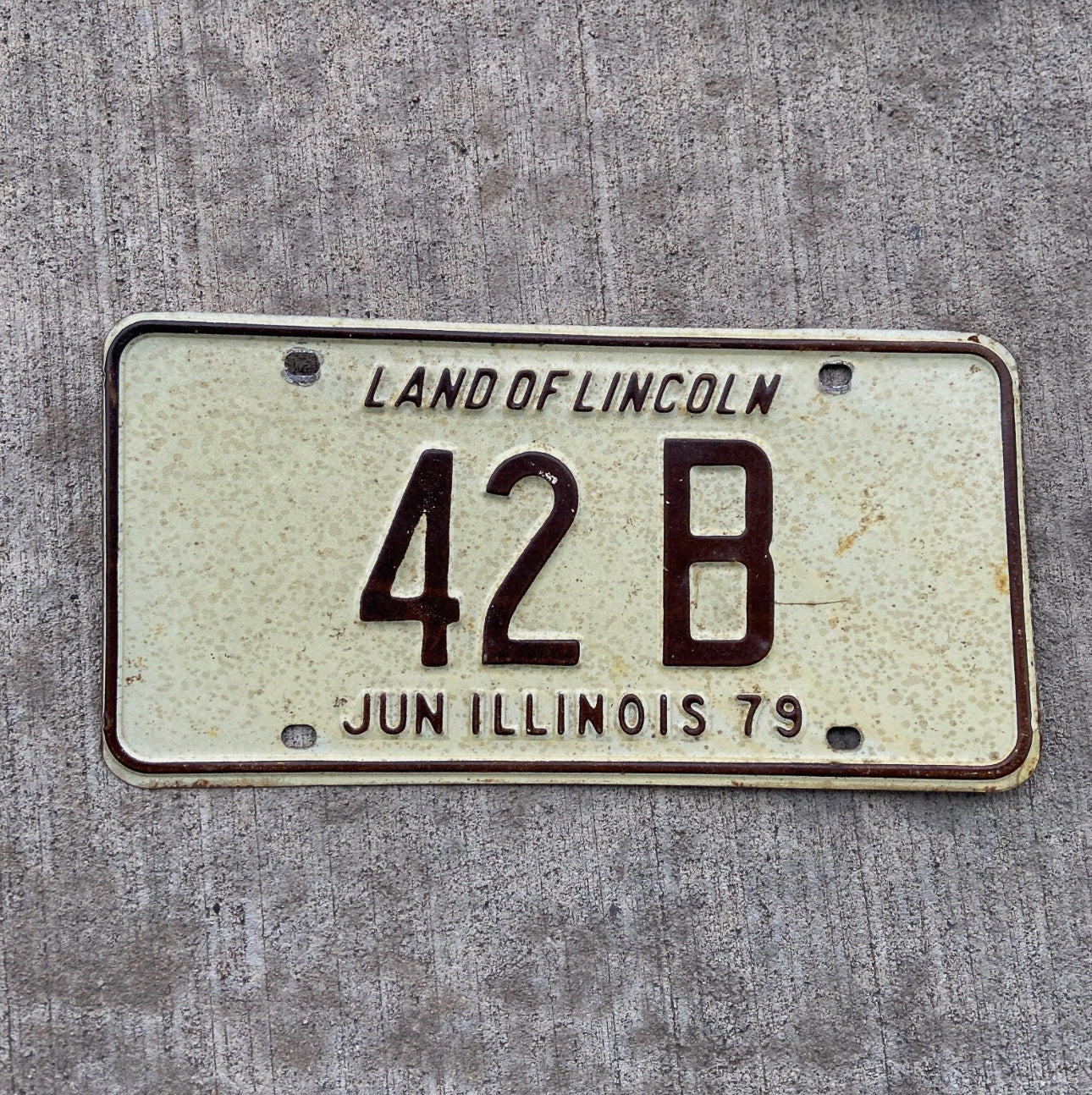 Photo of a 1979 Illinois Truck License Plate Auto Tag Garage Decor Vintage Low Number Two Digit 42 B with original patina