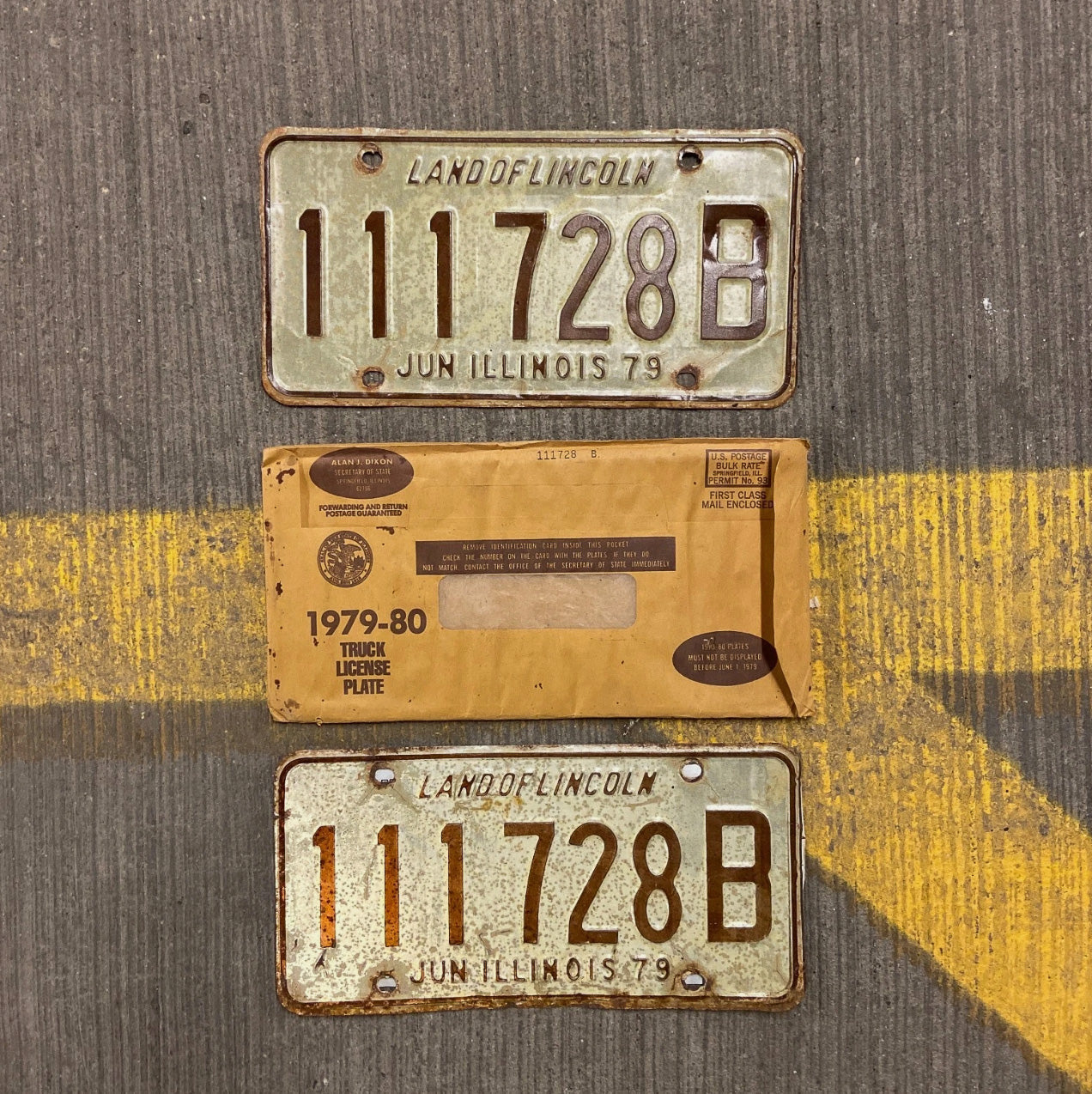 Photo of a 1979 Illinois Truck License Plate Pair Auto Tag Garage Decor Vintage Repeat Repeating 111 728 B with original patina