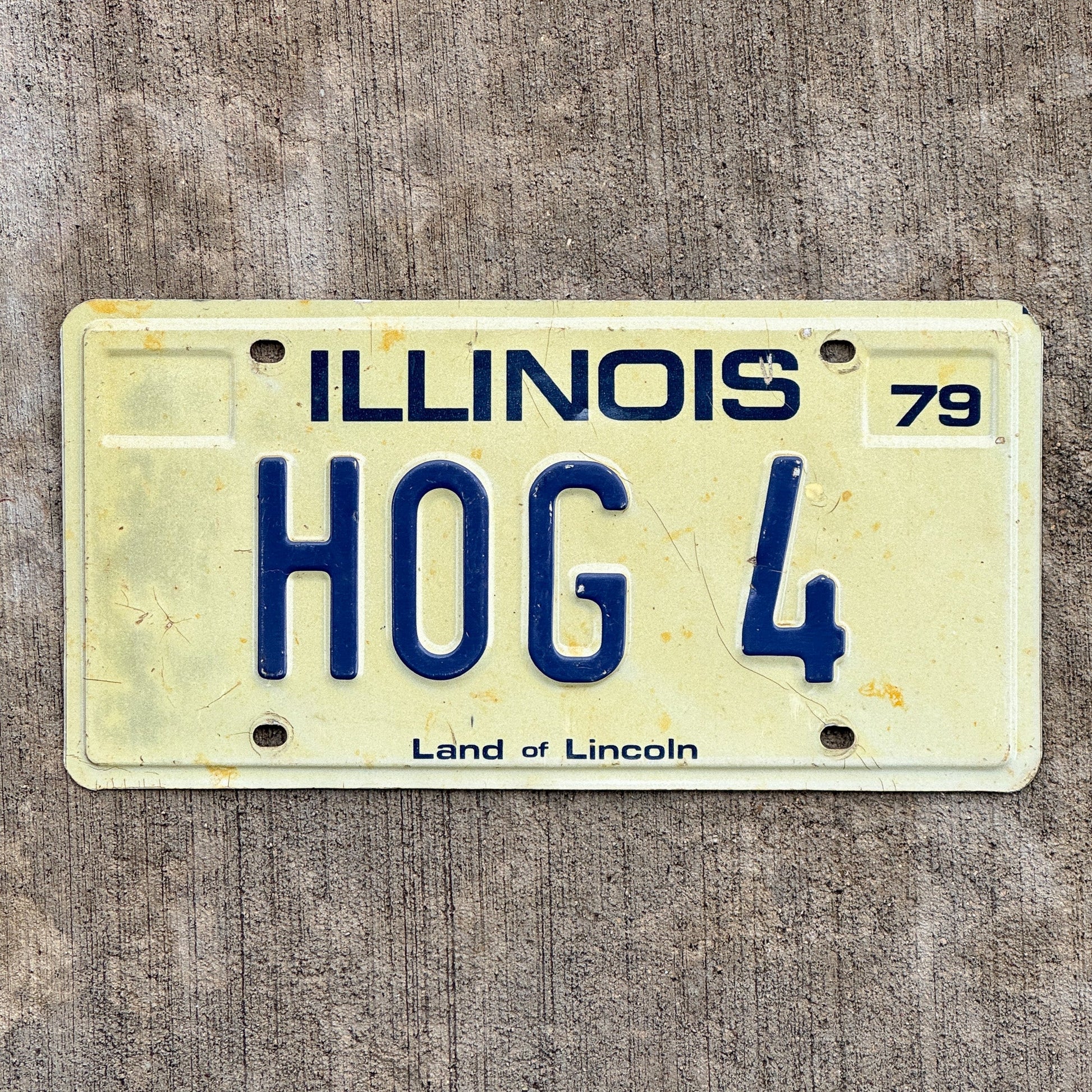 Photo of a 1979 Illinois Vanity License Plate Auto Tag Garage Decor Vintage Harley Motorcycle Enthusiast HOG 4 with original patina