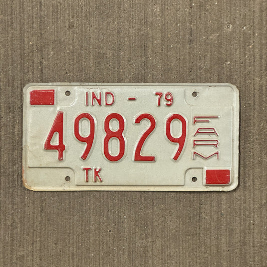Photo of a 1979 Indiana Farm Truck License Plate Auto Tag Garage Decor Vintage 49829 with original patina