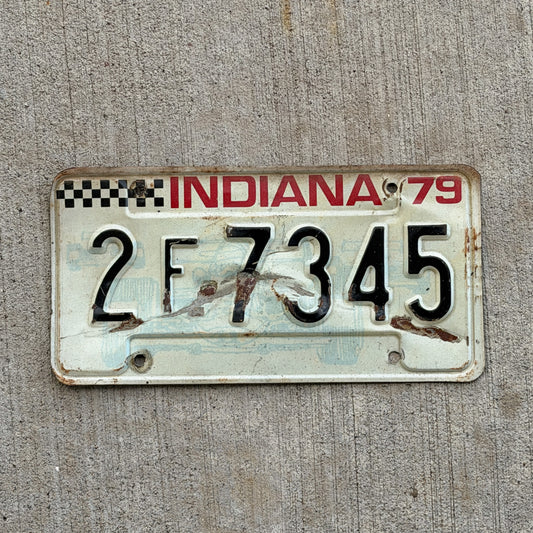 Photo of a 1979 Indiana License Plate Auto Tag Garage Decor Vintage Checkered Race Car 2 F 7345 with original patina