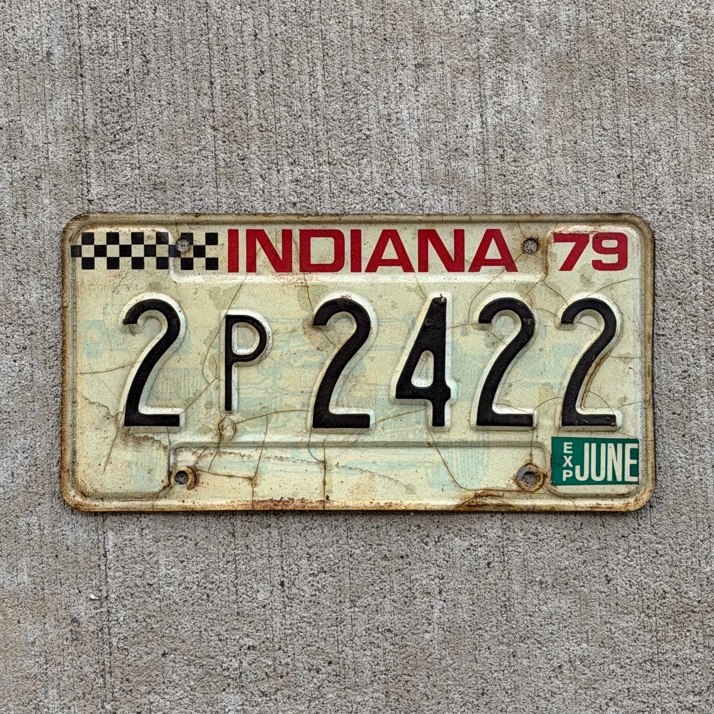 Photo of a 1979 Indiana License Plate Auto Tag Garage Decor Vintage Checkered Race Car 2 P 2422 with original patina