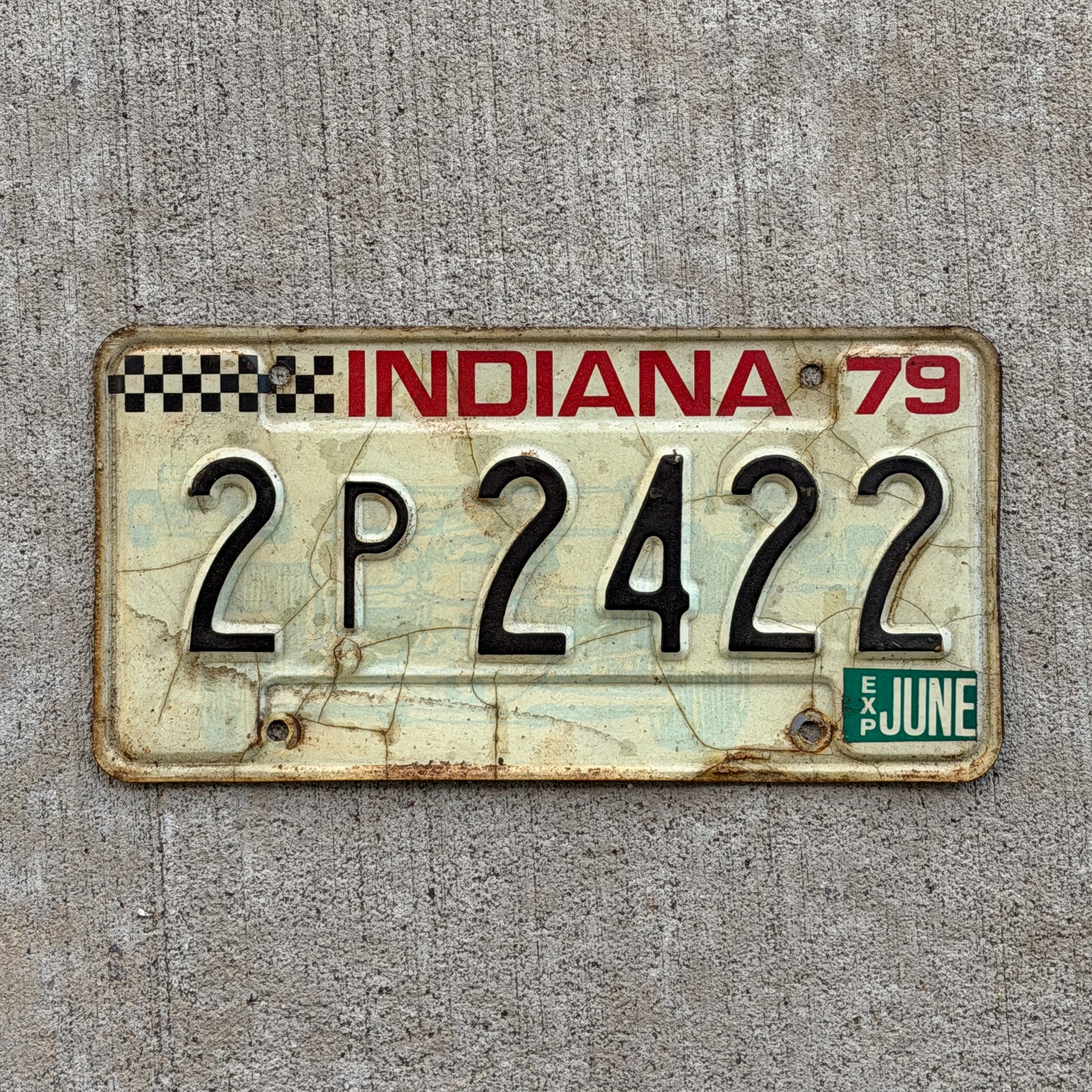 Photo of a 1979 Indiana License Plate Auto Tag Garage Decor Vintage Checkered Race Car 2 P 2422 with original patina