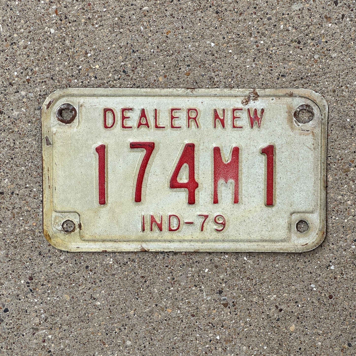 Photo of a 1979 Indiana Motorcycle Dealer License Plate Auto Tag Garage Decor Vintage 174 M 1 with original patina