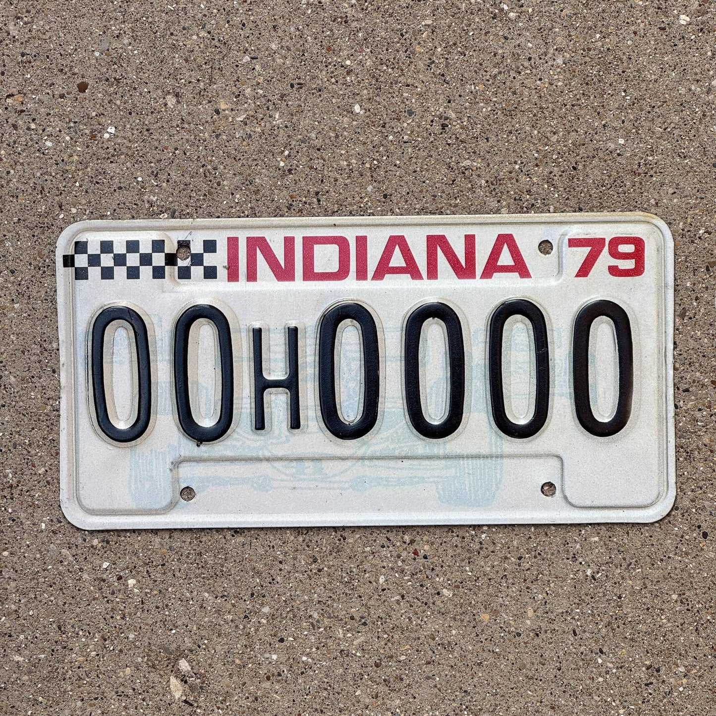 Photo of a 1979 Indiana Sample License Plate Auto Tag 1 Garage Decor 00H0000 with original patina