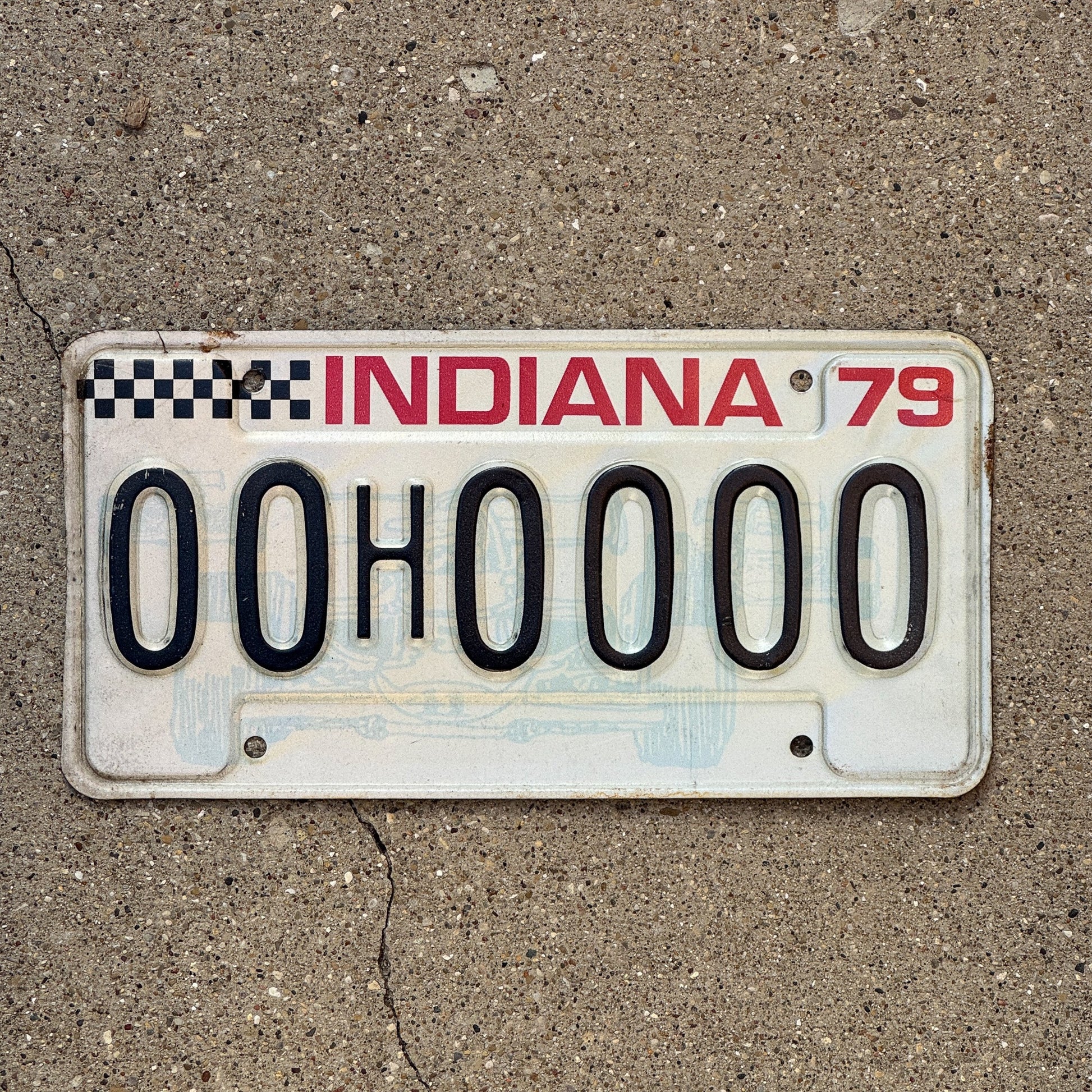 Photo of a 1979 Indiana Sample License Plate Auto Tag 2 Garage Decor 00H0000 with original patina