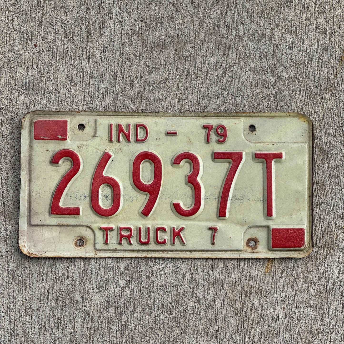 Photo of a 1979 Indiana Truck License Plate Auto Tag Garage Decor Vintage 26937 T with original patina