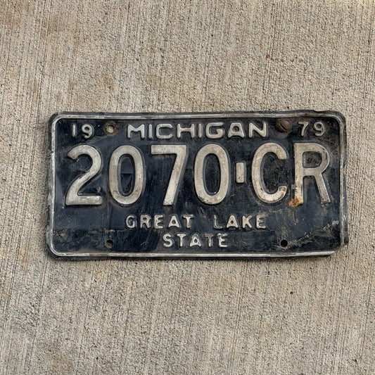 Photo of a 1979 Michigan Commercial License Plate Auto Tag Garage Decor Vintage 2070 CR with original patina