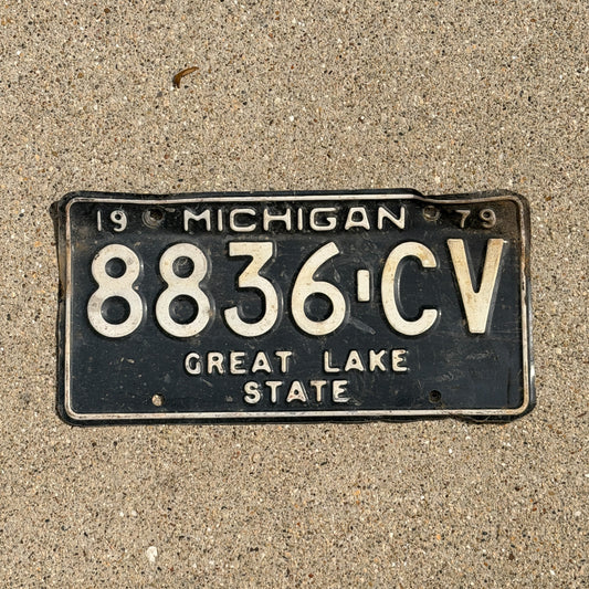 Photo of a 1979 Michigan Commercial License Plate Auto Tag Garage Decor Vintage 8836 CV with original patina