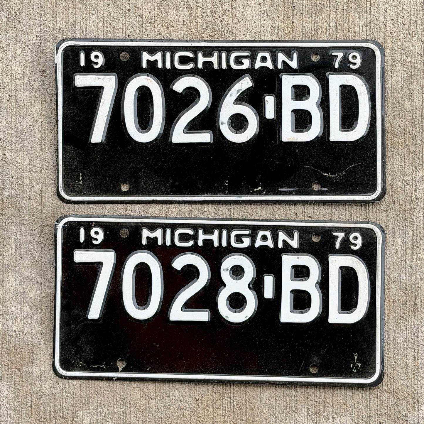 Photo of a 1979 Michigan Commercial License Plate Pair Auto Tag Garage Decor Vintage 7026 BD with original patina