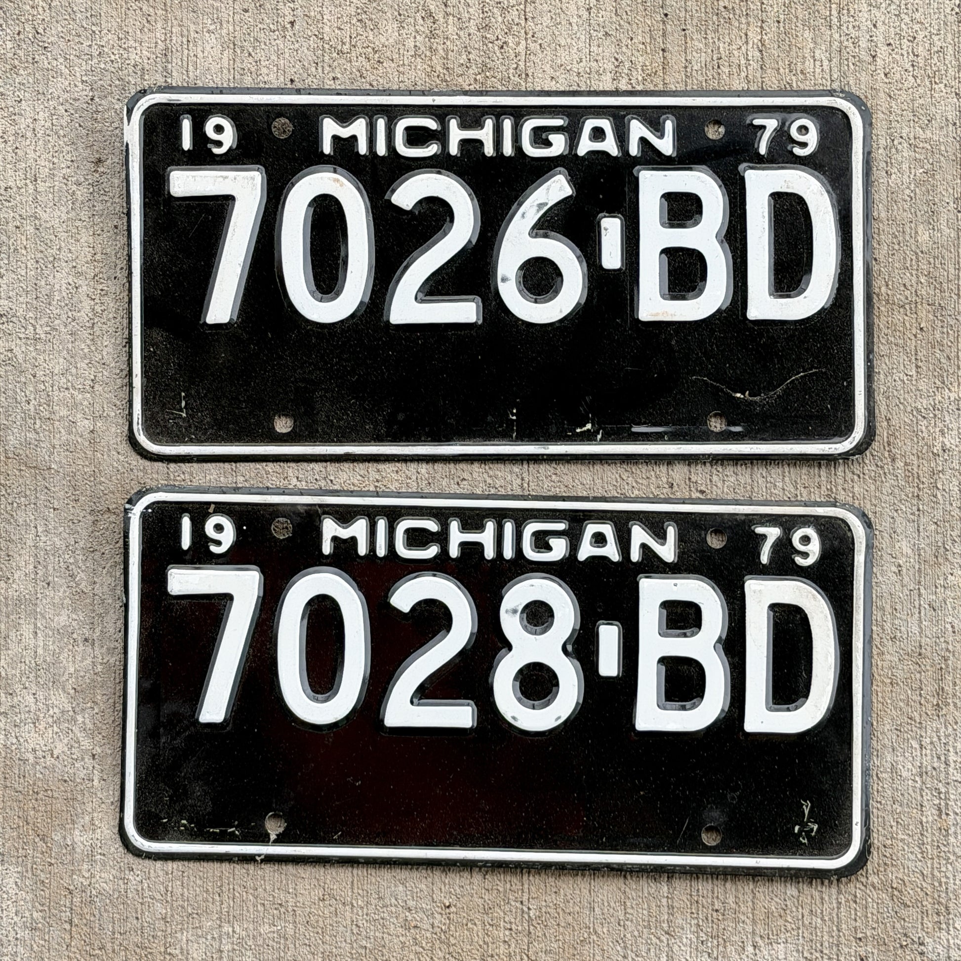 Photo of a 1979 Michigan Commercial License Plate Pair Auto Tag Garage Decor Vintage 7026 BD with original patina
