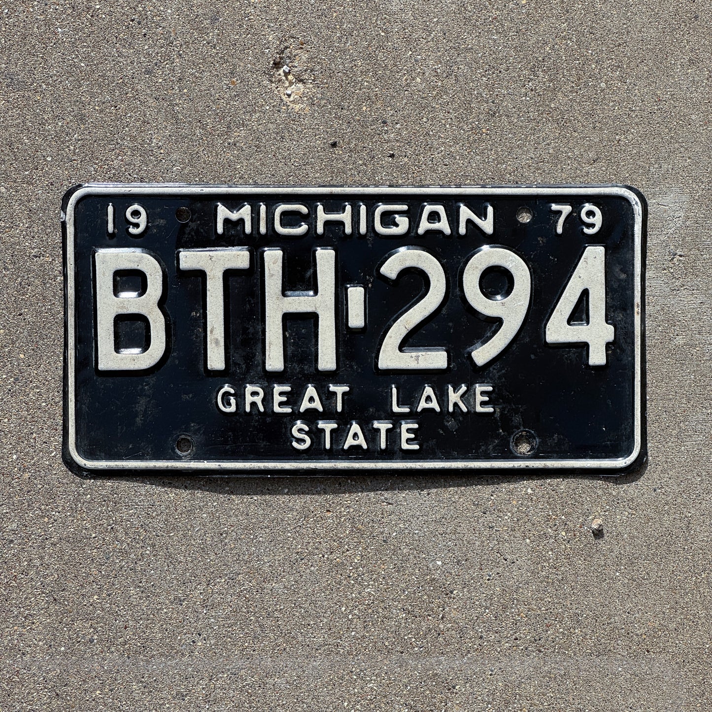 Photo of a 1979 Michigan License Plate Auto Tag 1 Vintage Garage BTH 294 with original patina