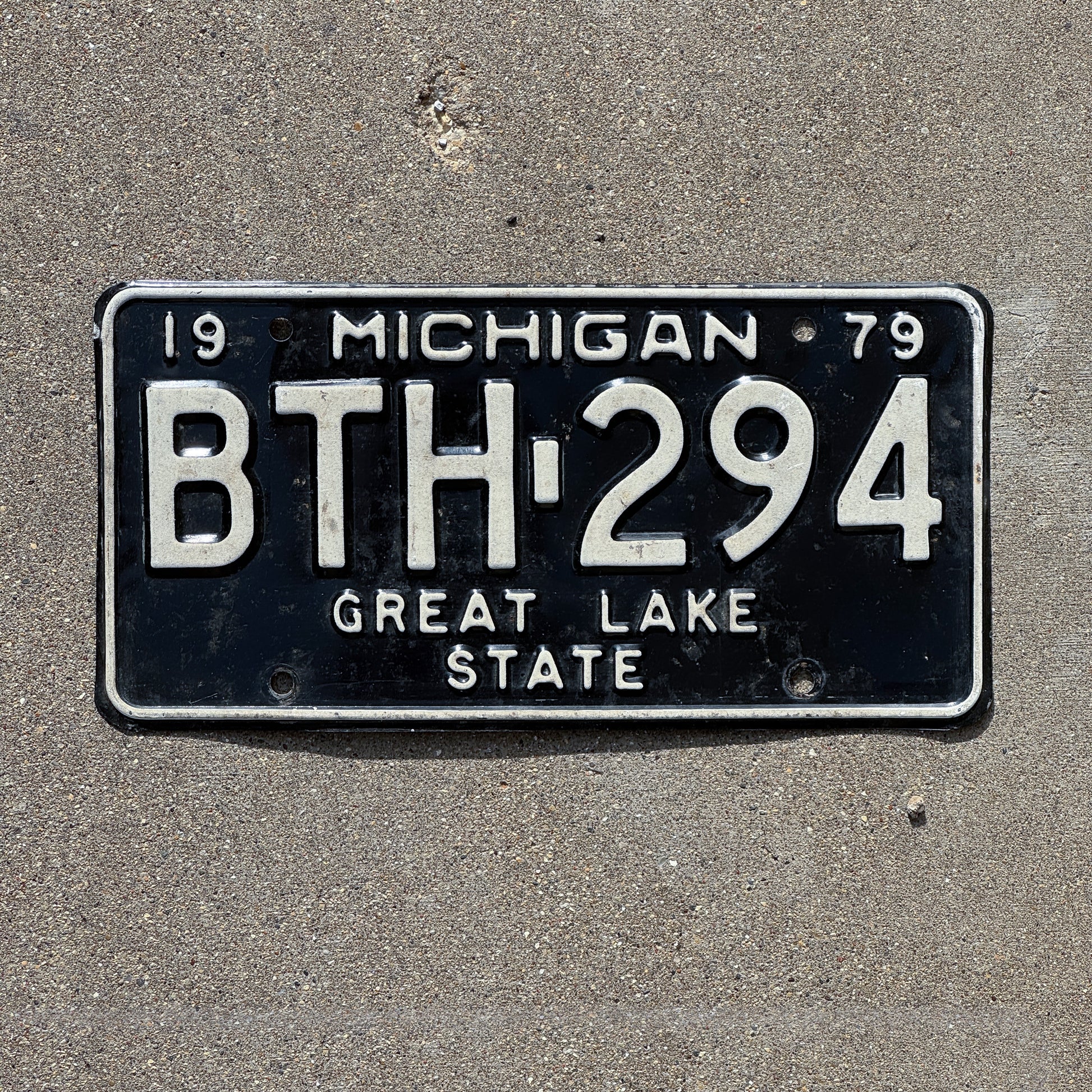 Photo of a 1979 Michigan License Plate Auto Tag 1 Vintage Garage BTH 294 with original patina