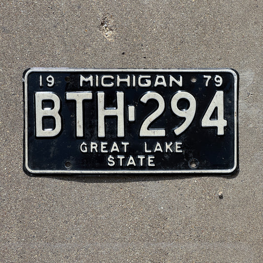 Photo of a 1979 Michigan License Plate Auto Tag 1 Vintage Garage BTH 294 with original patina