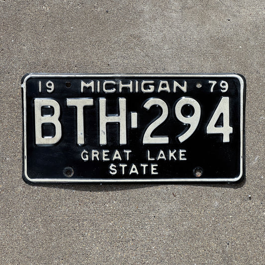Photo of a 1979 Michigan License Plate Auto Tag 2 Vintage Garage BTH 294 with original patina