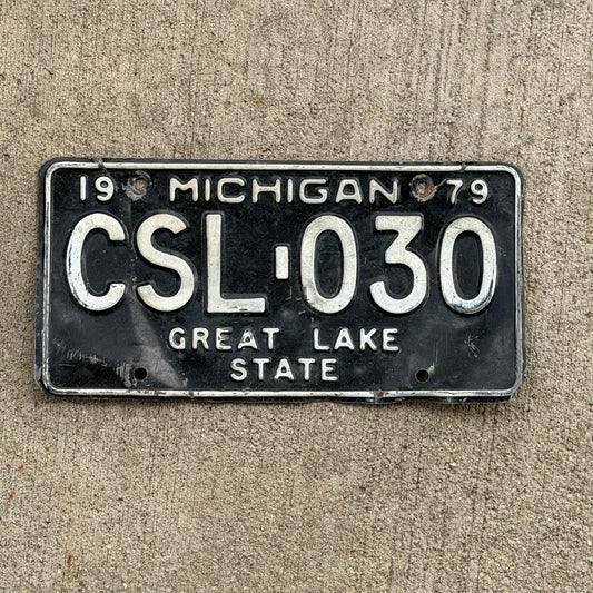 Photo of a 1979 Michigan License Plate Auto Tag Garage Decor Vintage CSL 030 with original patina