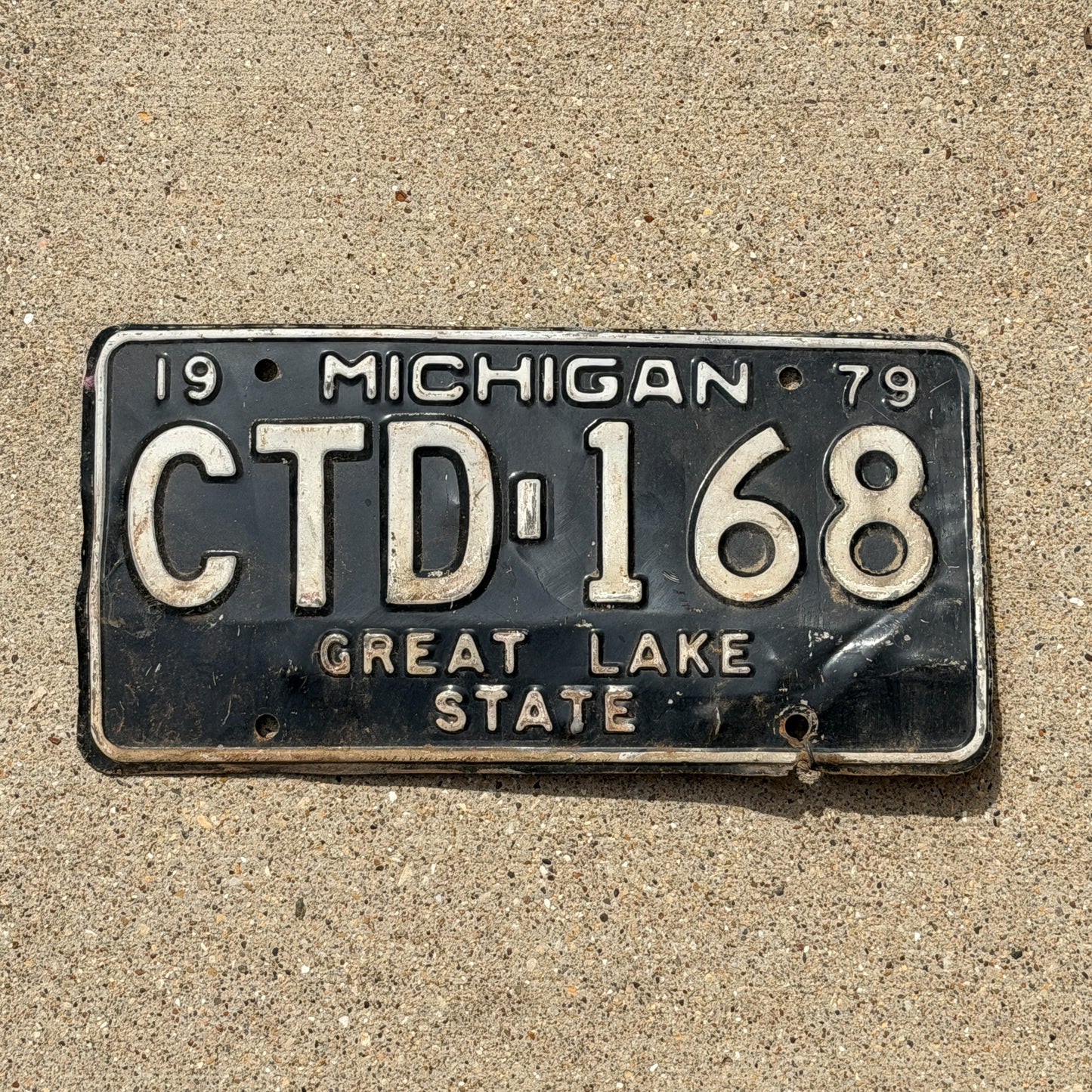Photo of a 1979 Michigan License Plate Auto Tag Garage Decor Vintage CTD 168 with original patina