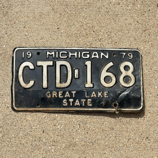 Photo of a 1979 Michigan License Plate Auto Tag Garage Decor Vintage CTD 168 with original patina