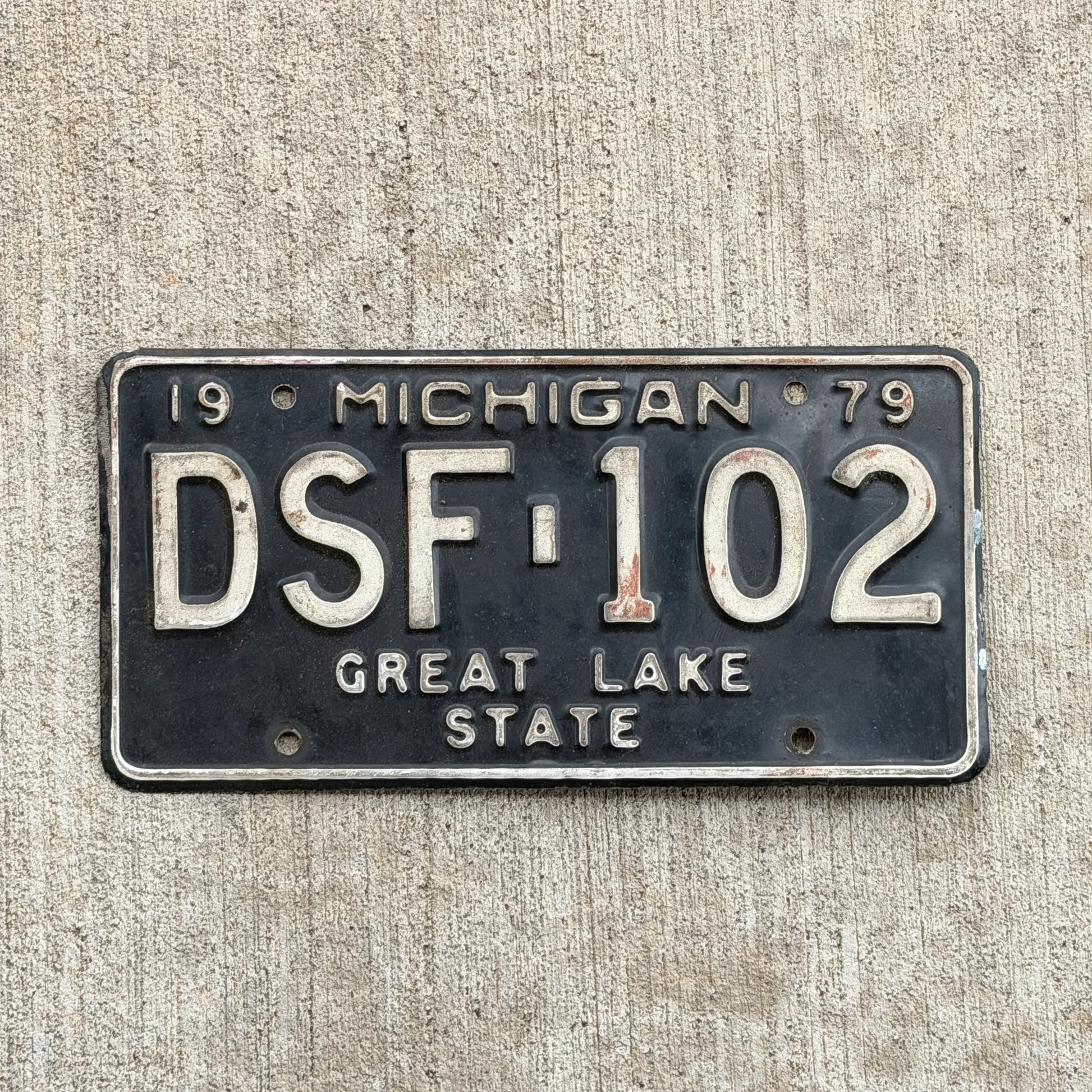 Photo of a 1979 Michigan License Plate Auto Tag Garage Decor Vintage DSF 102 with original patina