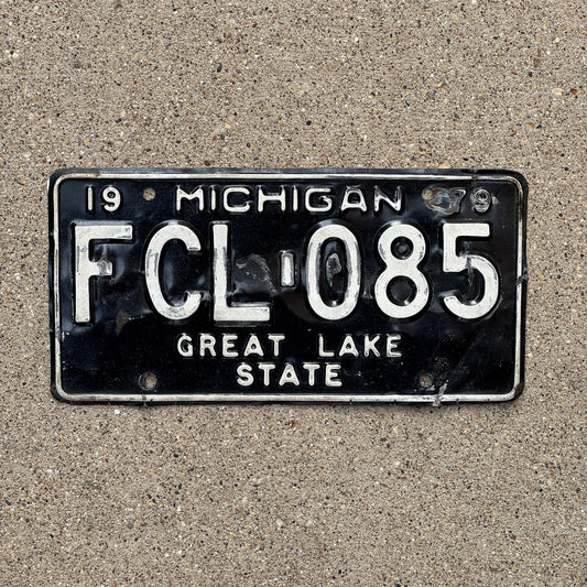 Photo of a 1979 Michigan License Plate Auto Tag Garage Decor Vintage FCL 085 with original patina