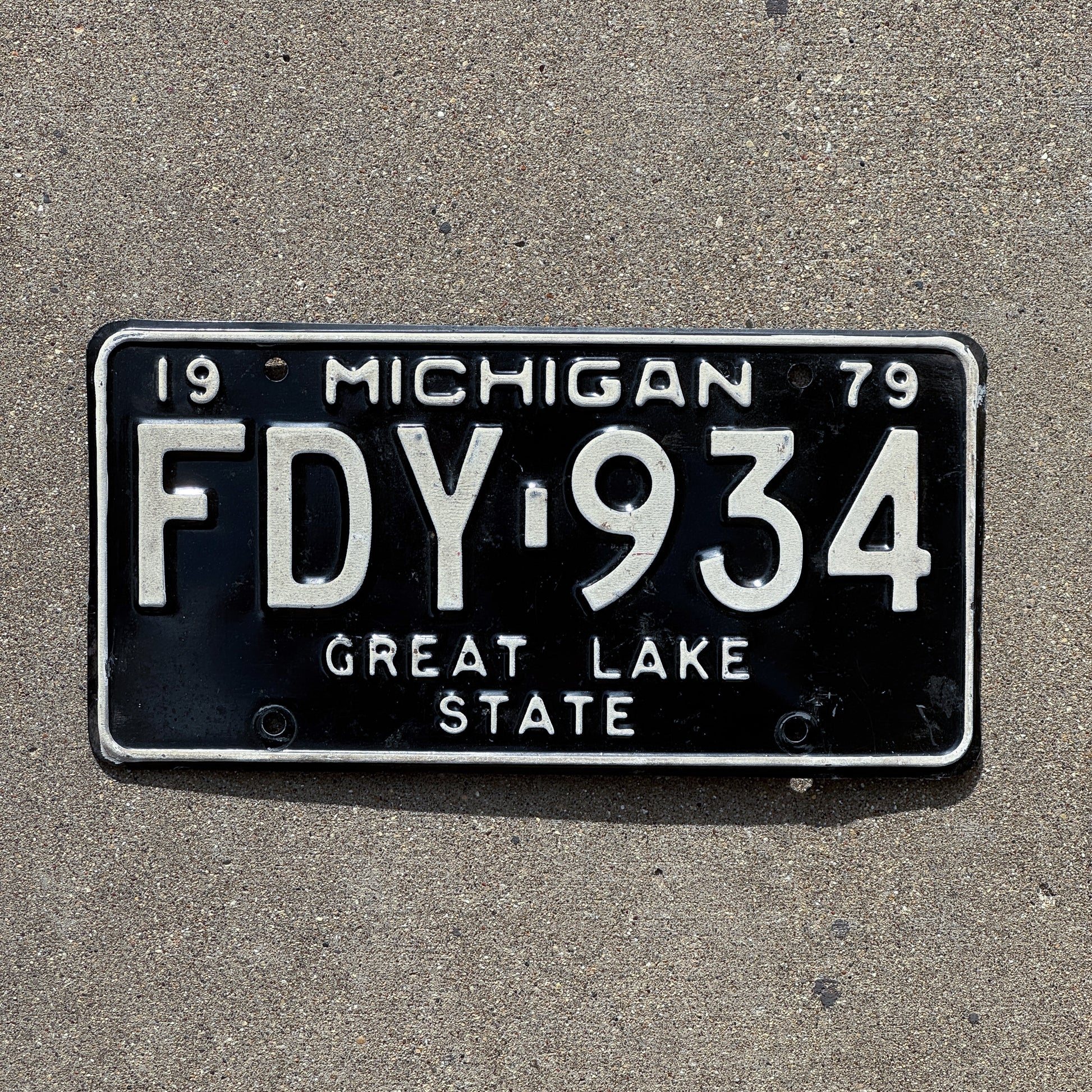 Photo of a 1979 Michigan License Plate Auto Tag Garage Decor Vintage FDY 934 with original patina