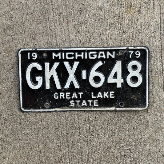 Photo of a 1979 Michigan License Plate Auto Tag Garage Decor Vintage GKX 648 with original patina