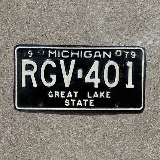 Photo of a 1979 Michigan License Plate Auto Tag Garage Decor Vintage RGV 401 with original patina