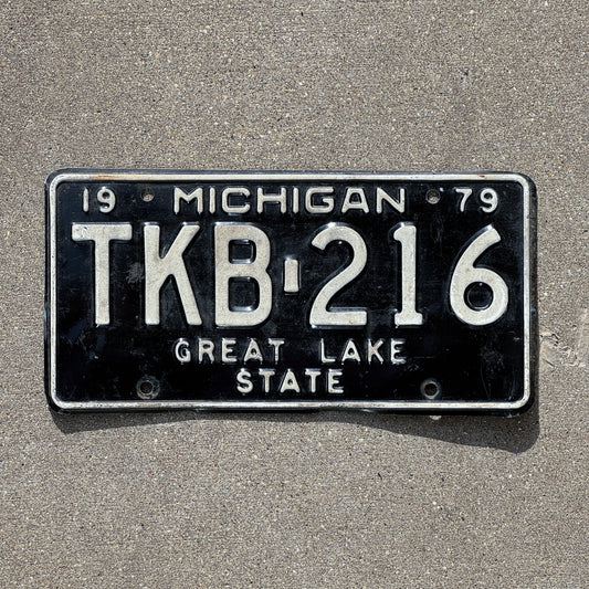 Photo of a 1979 Michigan License Plate Auto Tag Garage Decor Vintage TKB 216 with original patina