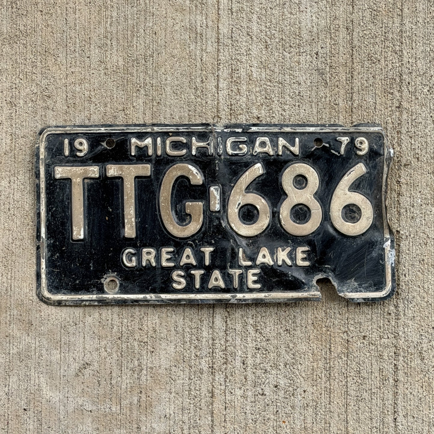 Photo of a 1979 Michigan License Plate Auto Tag Garage Decor Vintage TTG 686 with original patina