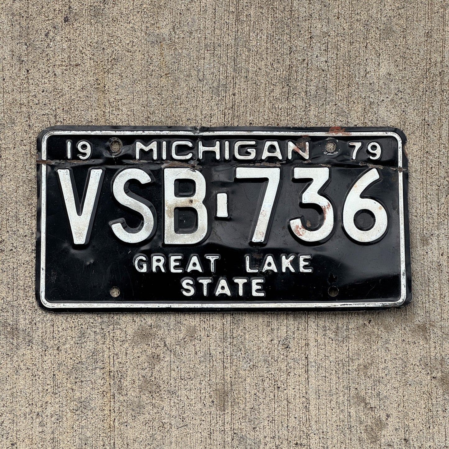 Photo of a 1979 Michigan License Plate Auto Tag Garage Decor Vintage VSB 736 with original patina