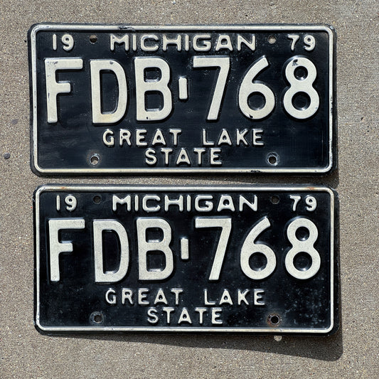 Photo of a 1979 Michigan License Plate Pair Auto Tag Garage Decor Vintage FDB 768 with original patina