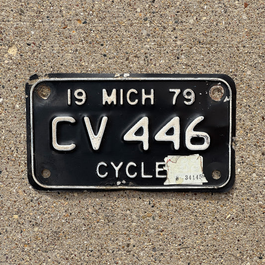 Photo of a 1979 Michigan Motorcycle License Plate Auto Tag Garage Decor Vintage CV 446 with original patina