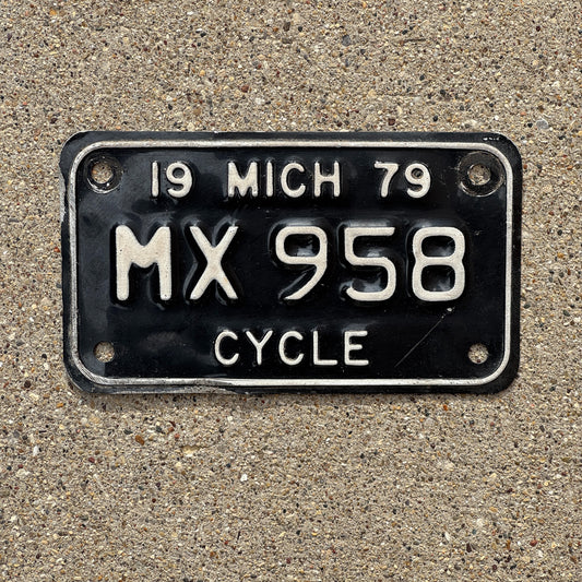 Photo of a 1979 Michigan Motorcycle License Plate Auto Tag Garage Decor Vintage MX 958 with original patina