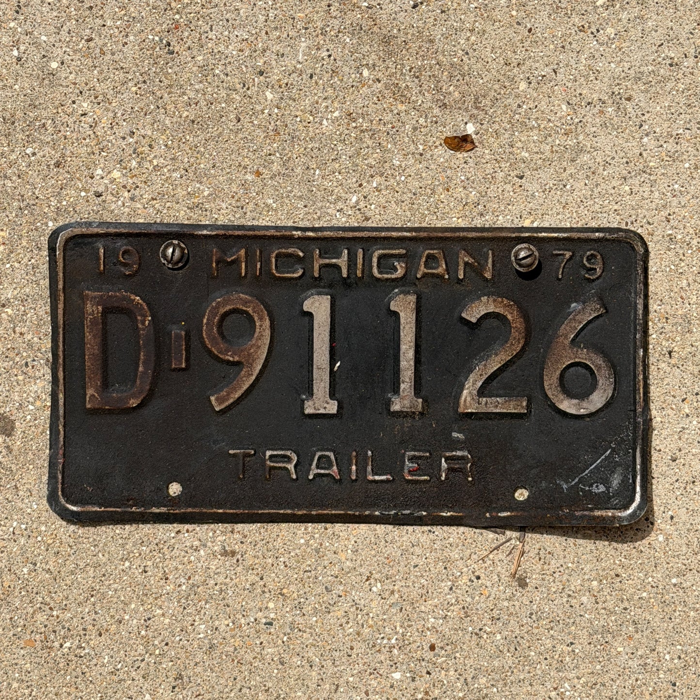 Photo of a 1979 Michigan Trailer License Plate Auto Tag Garage Decor Vintage D 91126 with original patina
