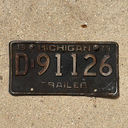 Photo of a 1979 Michigan Trailer License Plate Auto Tag Garage Decor Vintage D 91126 with original patina