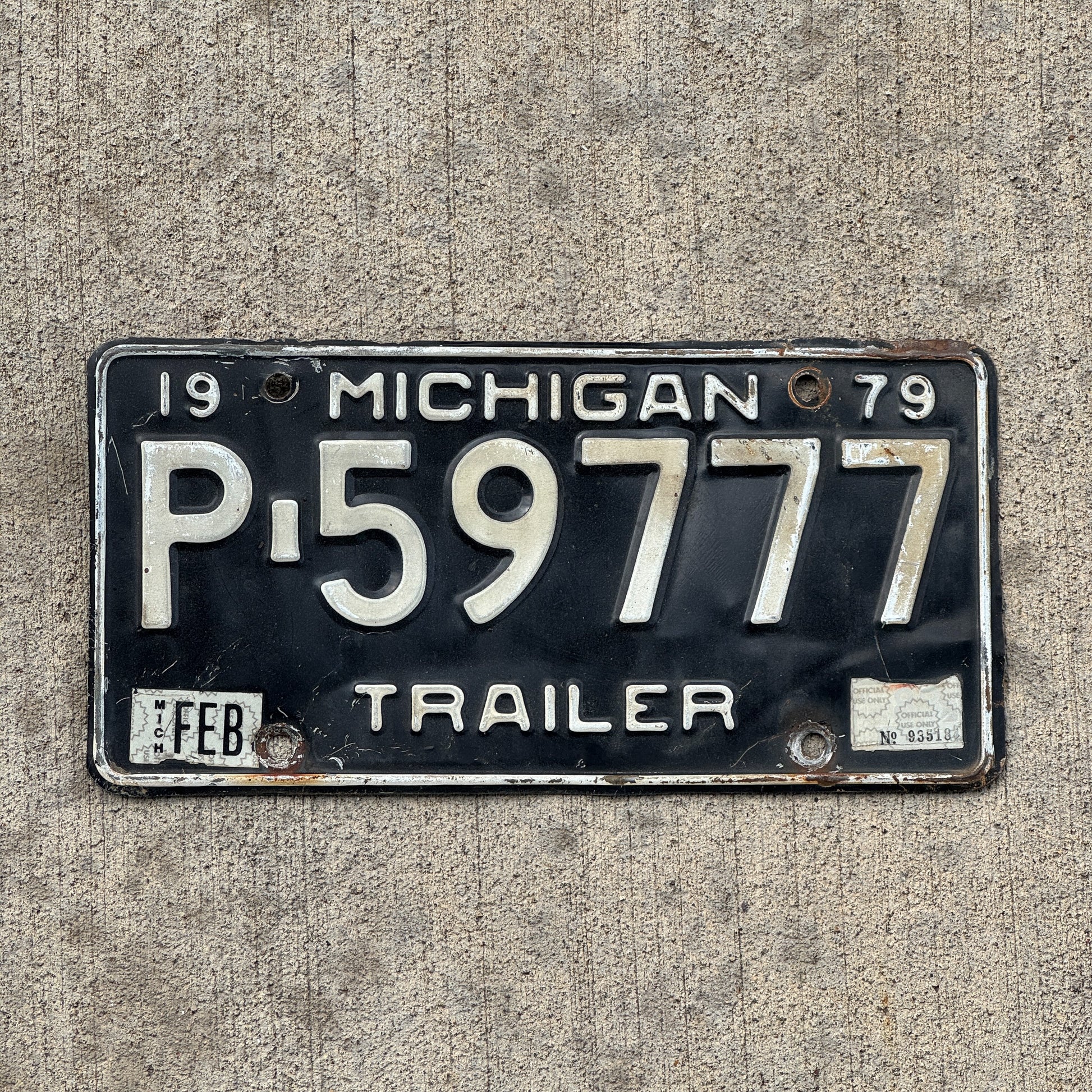 Photo of a 1979 Michigan Trailer License Plate Auto Tag Garage Decor Vintage Lucky 7 Repeat Repeating P 59777 with original patina