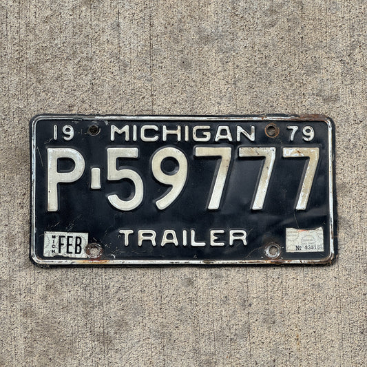 Photo of a 1979 Michigan Trailer License Plate Auto Tag Garage Decor Vintage Lucky 7 Repeat Repeating P 59777 with original patina