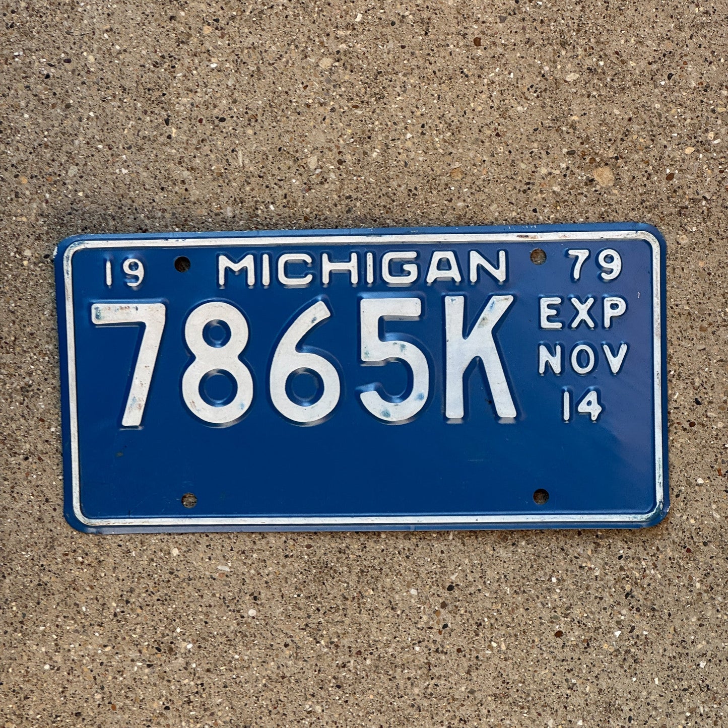 Photo of a 1979 Michigan Truck Half Year License Plate Auto Tag Garage Decor Vintage November 7865 K