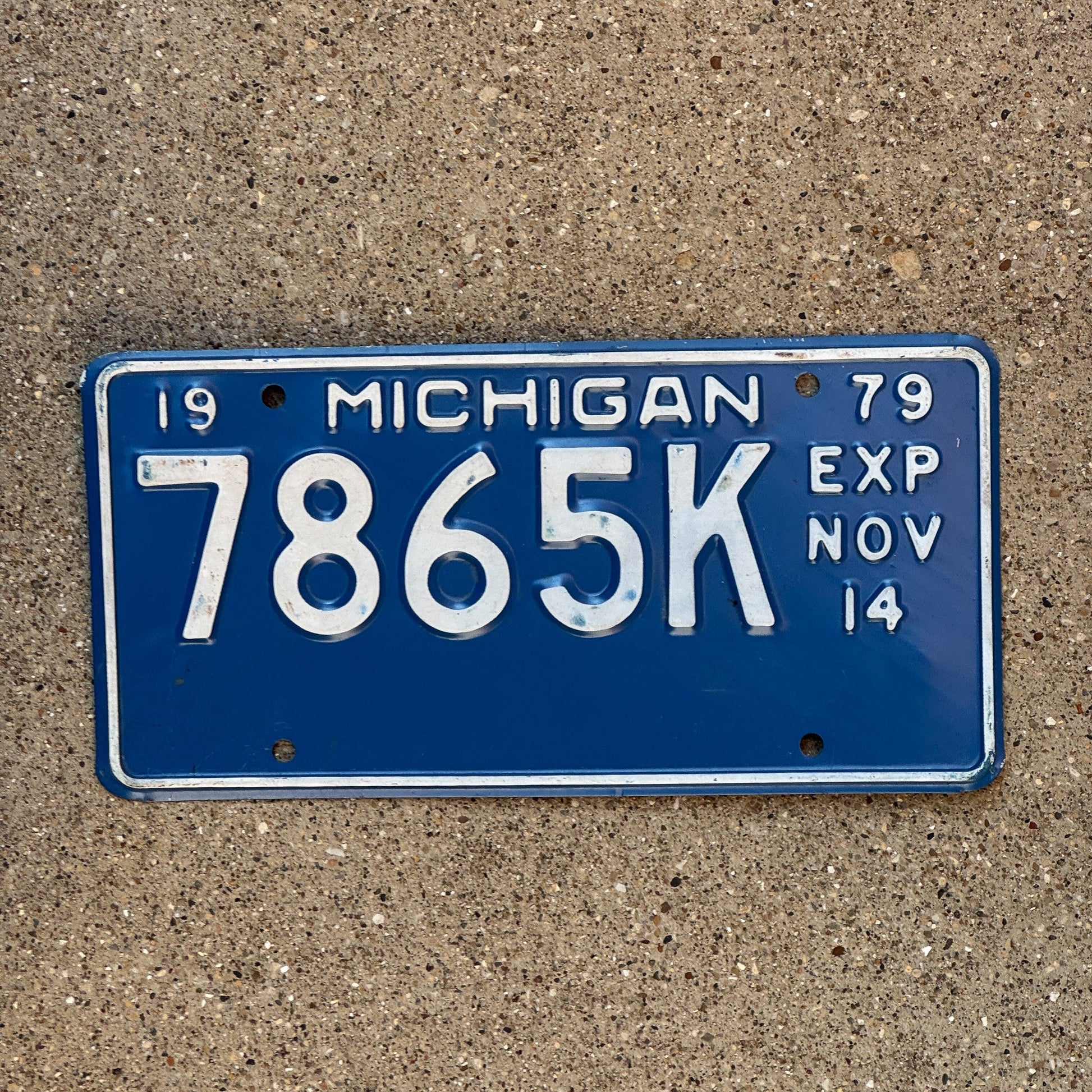 Photo of a 1979 Michigan Truck Half Year License Plate Auto Tag Garage Decor Vintage November 7865 K