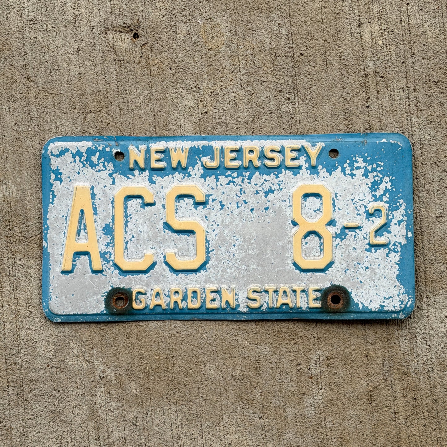 Photo of a 1979 New Jersey Courtesy License Plate Auto Tag Garage Decor Vintage Blue Atlantic County ACS 8 2 with original patina
