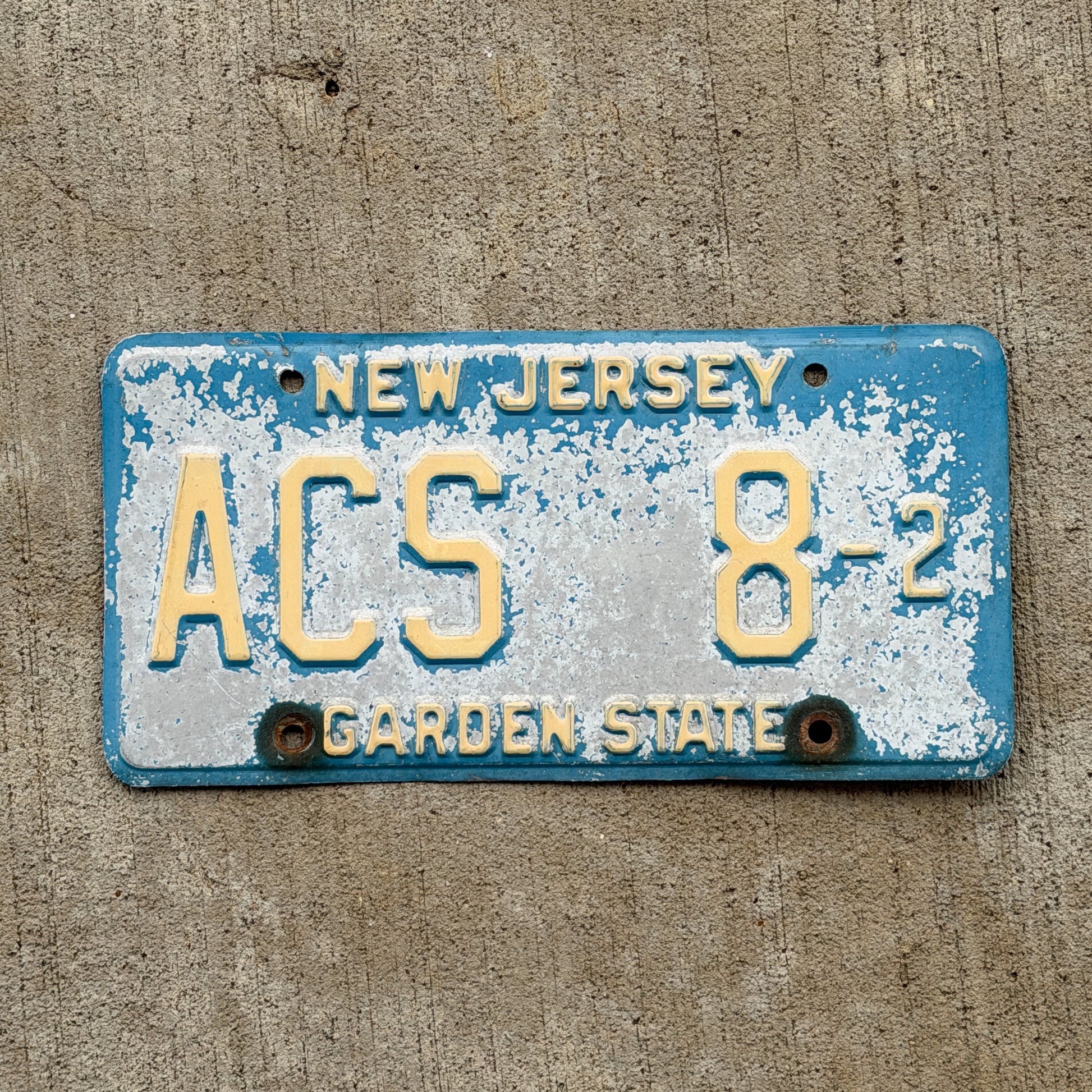 Photo of a 1979 New Jersey Courtesy License Plate Auto Tag Garage Decor Vintage Blue Atlantic County ACS 8 2 with original patina