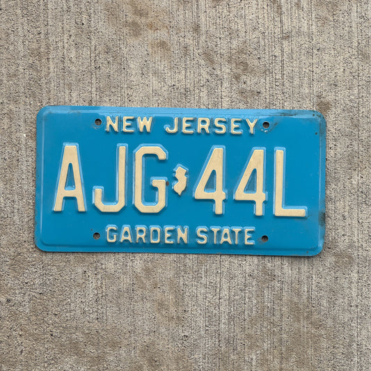 Photo of a 1979 New Jersey License Plate Auto Tag 2 Vintage Garage Blue AJG 44L with original patina