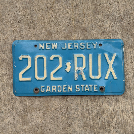 Photo of a 1979 New Jersey License Plate Auto Tag Garage Decor Vintage Blue 202 RUX with original patina