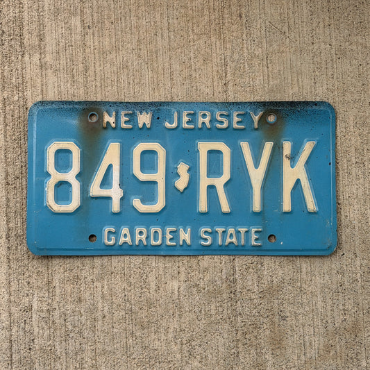 Photo of a 1979 New Jersey License Plate Auto Tag Garage Decor Vintage Blue 849 RYK with original patina