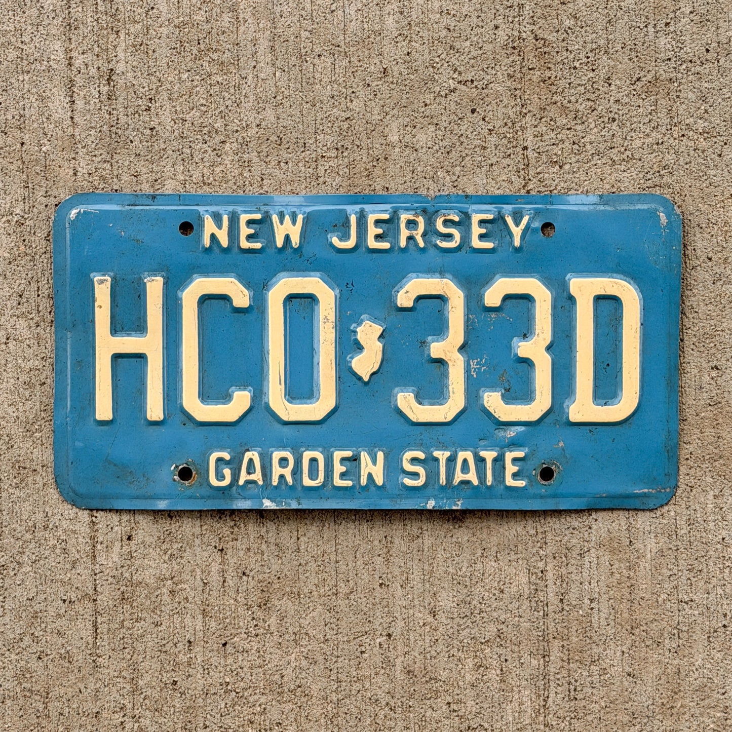 Photo of a 1979 New Jersey License Plate Auto Tag Garage Decor Vintage Blue HC 0 33D with original patina