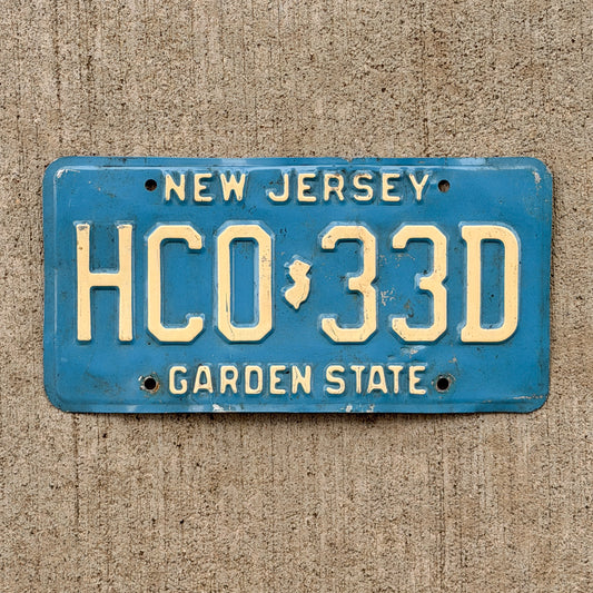 Photo of a 1979 New Jersey License Plate Auto Tag Garage Decor Vintage Blue HC 0 33D with original patina