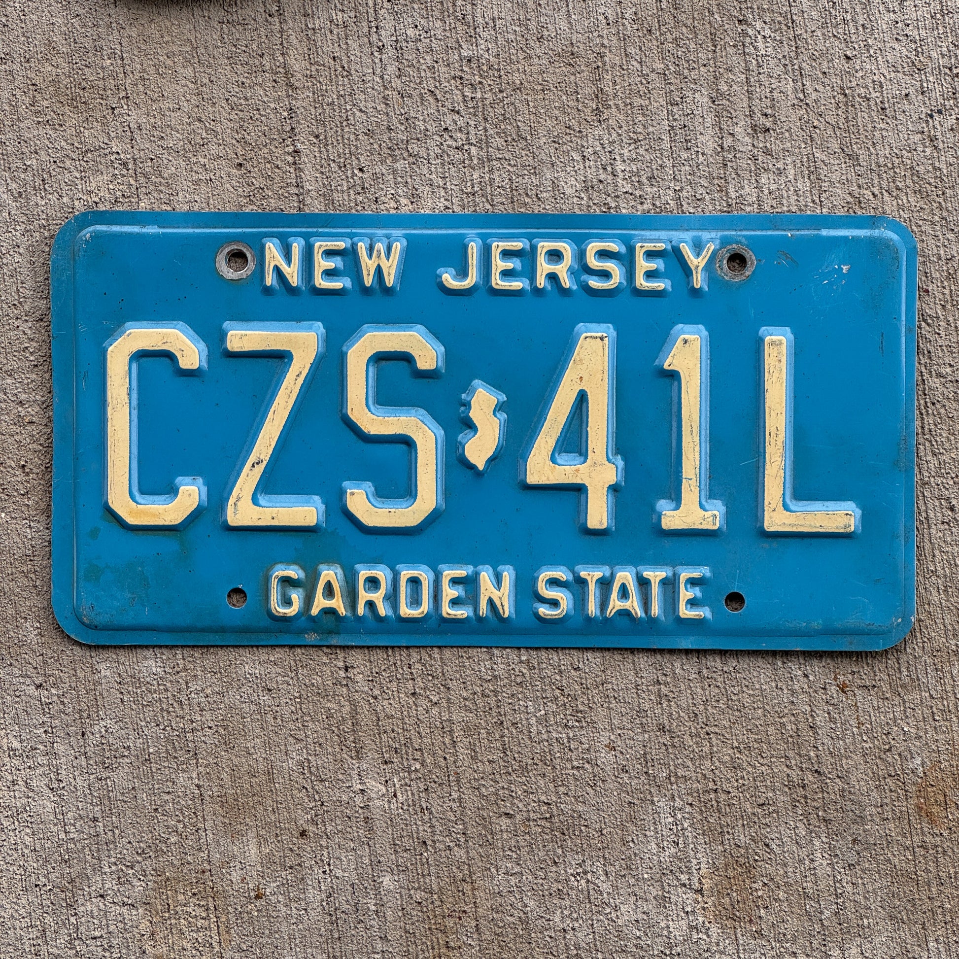 Photo of a 1979 New Jersey License Plate Auto Tag Garage Decor Vintage CZS 41L with original patina